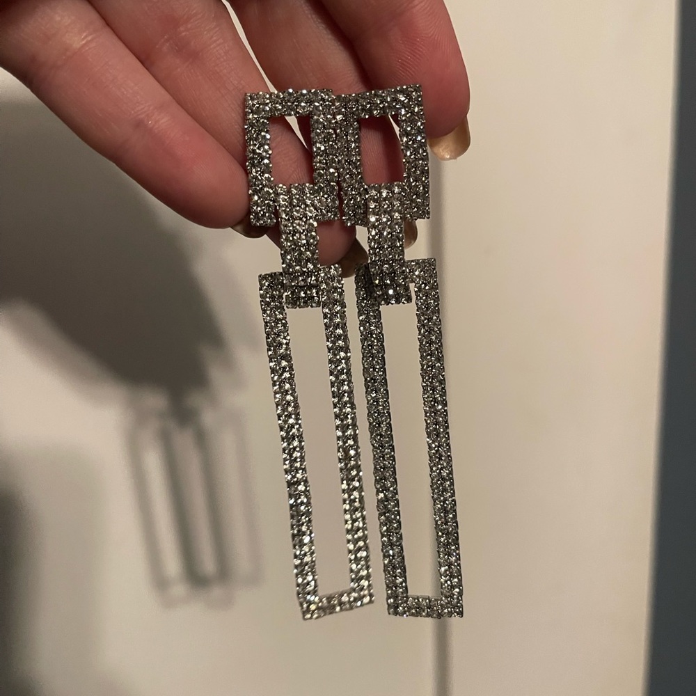 Shinny dangle earrings. Brand new